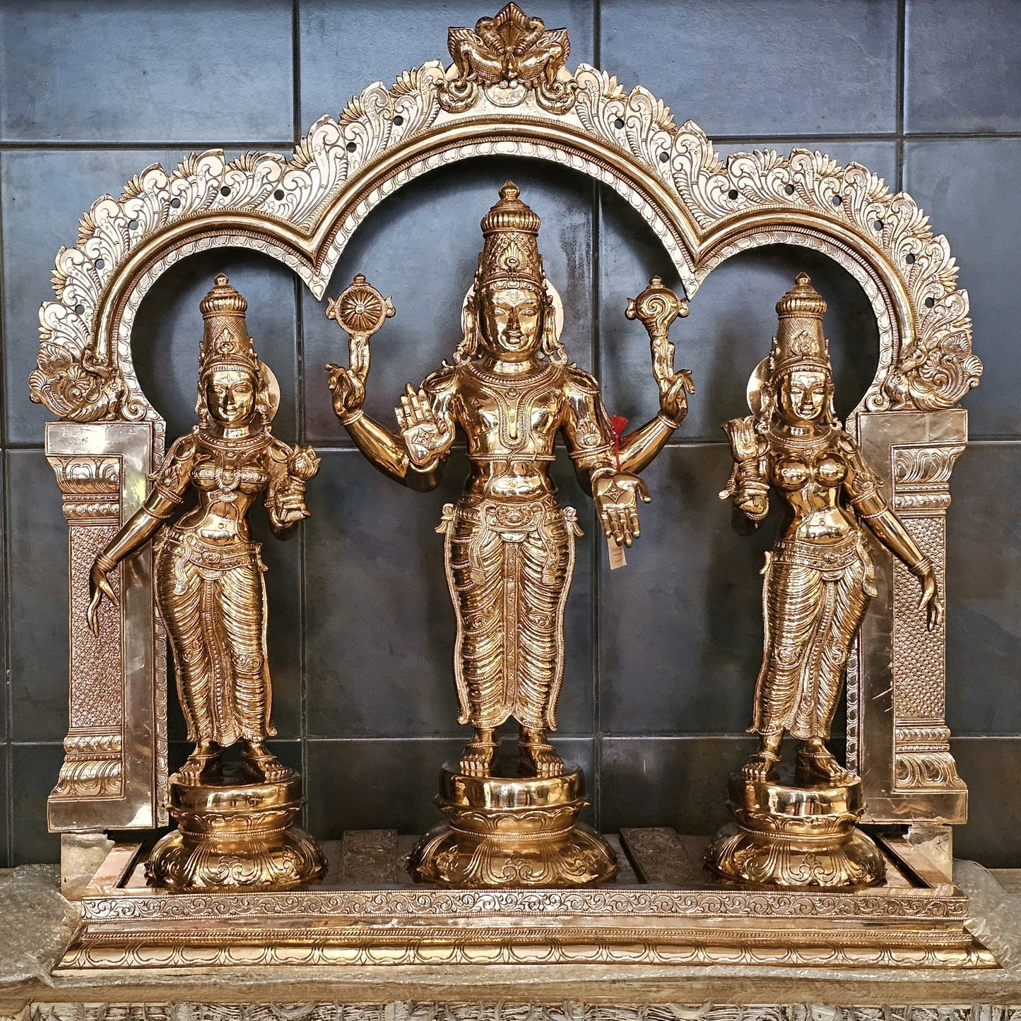33"' Vishnu Murthy with Sri Devi and Bhu Devi with arch in Bronze