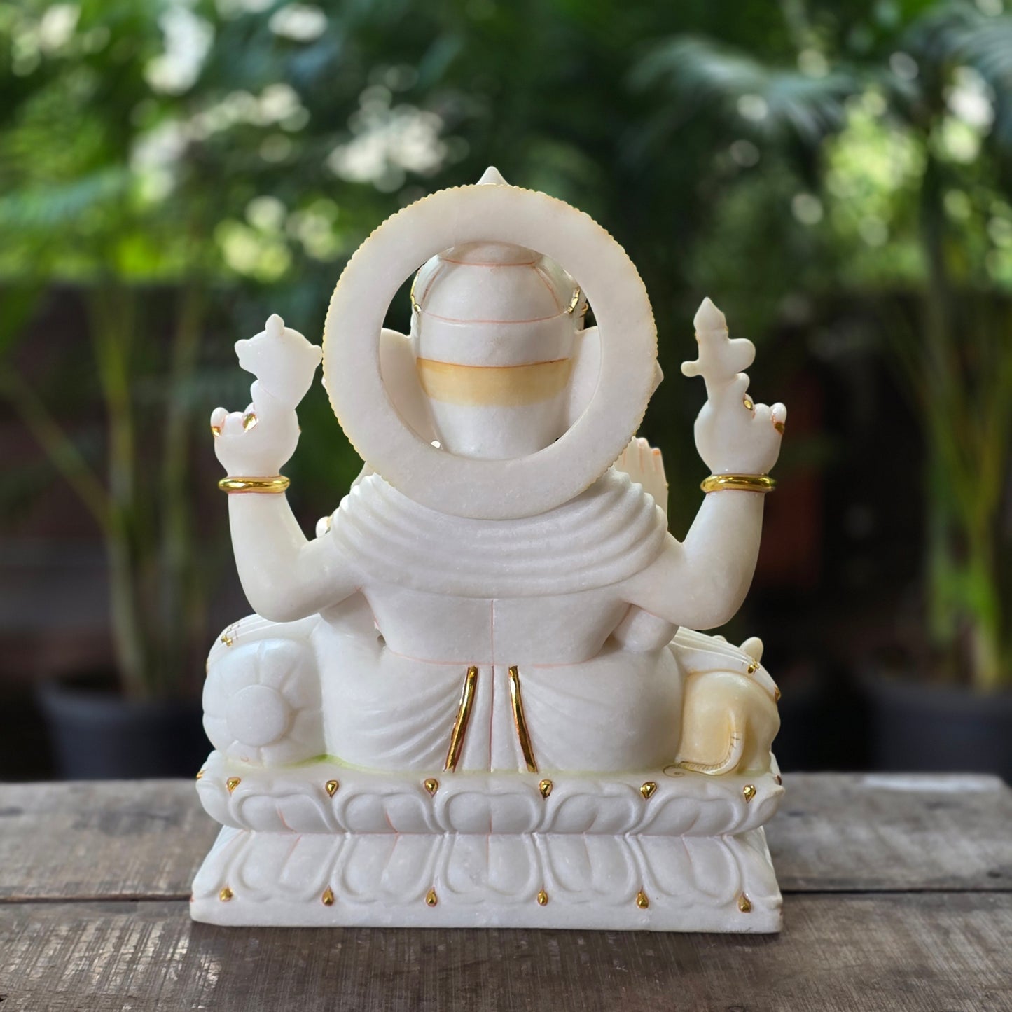19" Chaturbuja Ganesha in Marble, this sitting posture of Ganesha on lotus base makes it even more attractive.