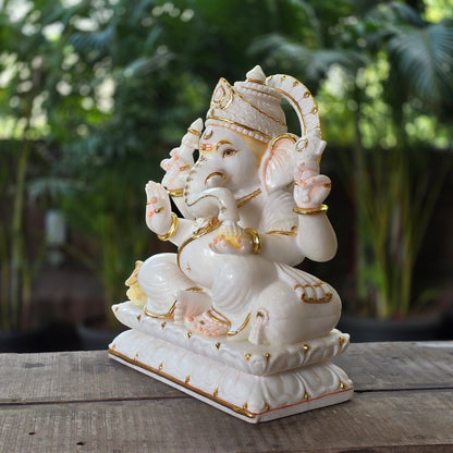 19" Chaturbuja Ganesha in Marble, this sitting posture of Ganesha on lotus base makes it even more attractive.